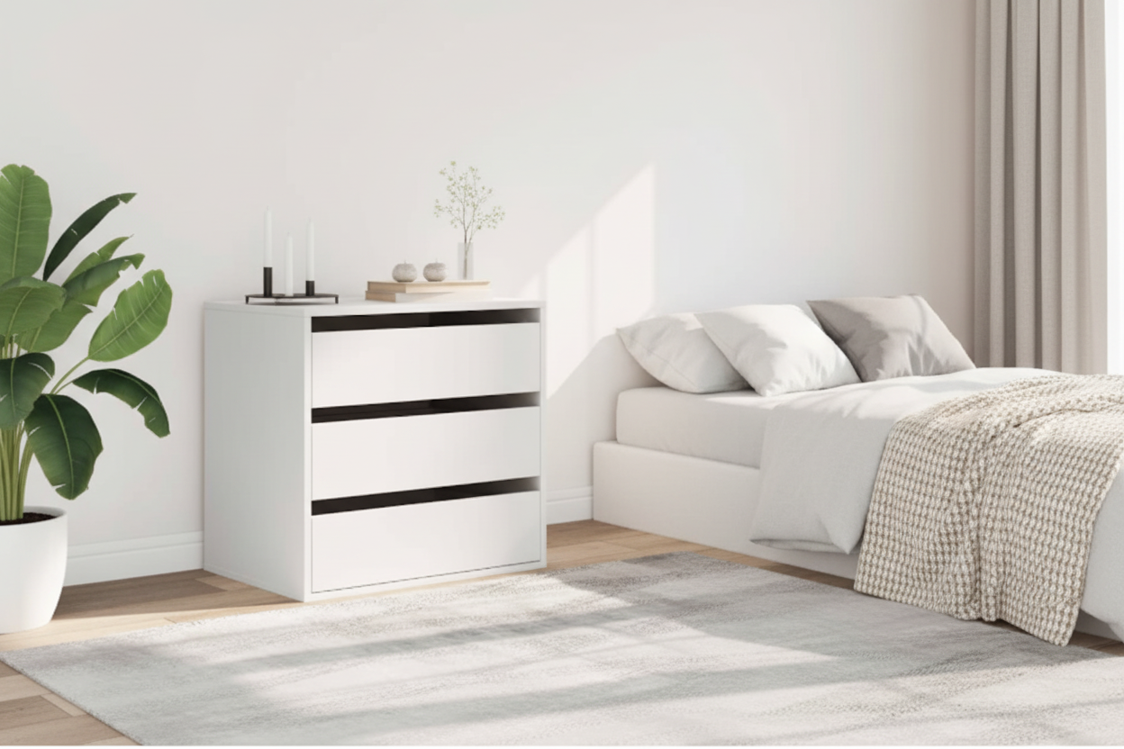 Modern bedroom with white chest and cozy textiles in bright natural light